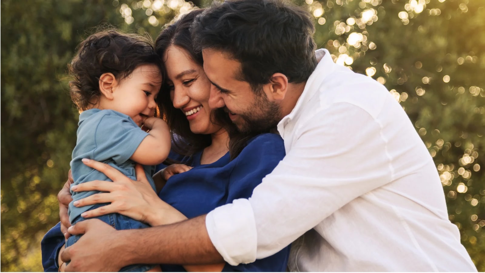 Parents embracing their young child