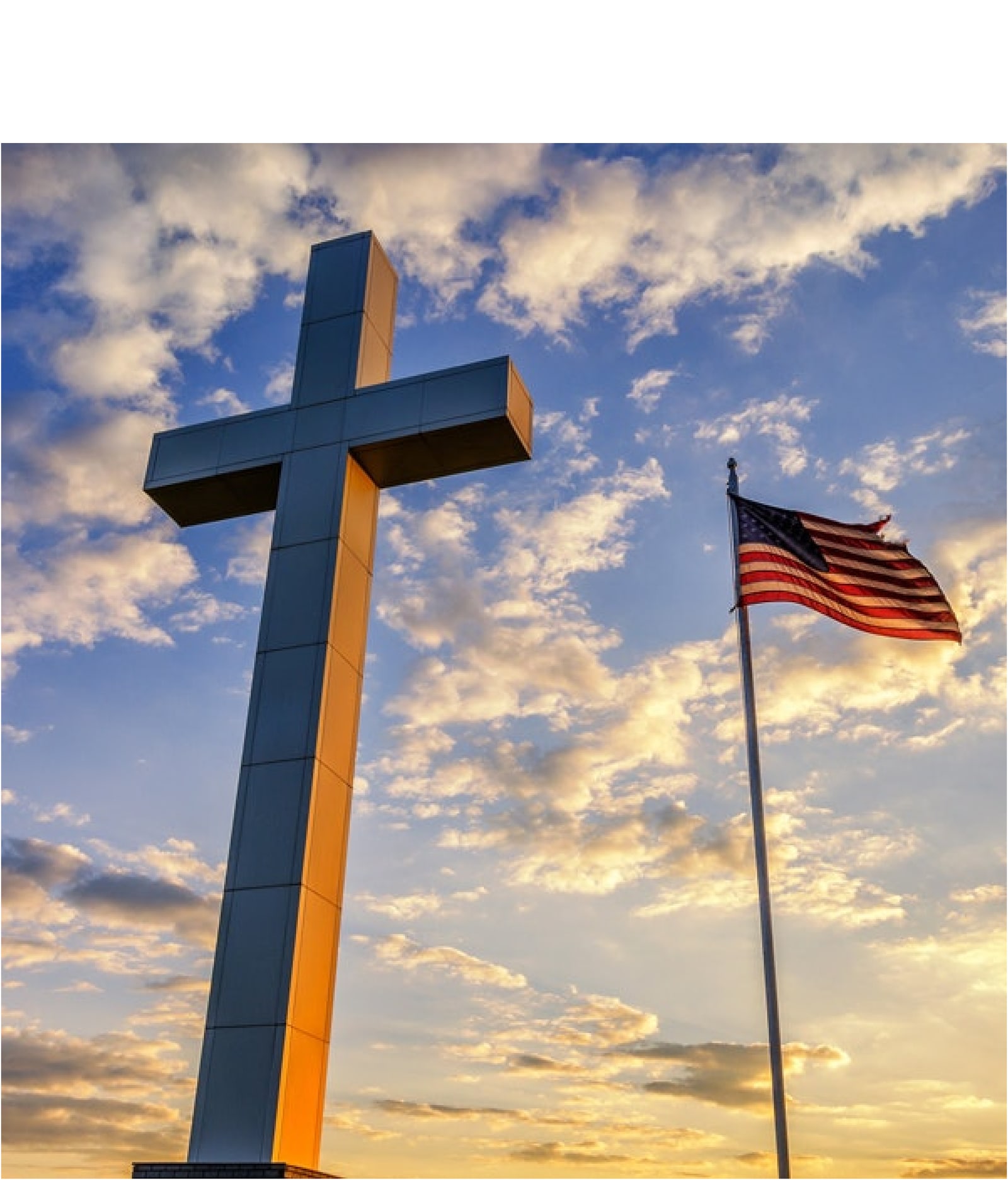 Cross and American flag against a sunrise sky